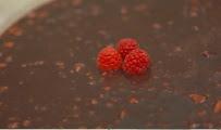 Chocolate ganache dessert with fresh raspberries by Selar