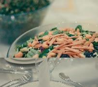 Green salad with toasted almonds, plated by Selar