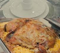 Whole roasted chicken over golden rice, a Selar signature